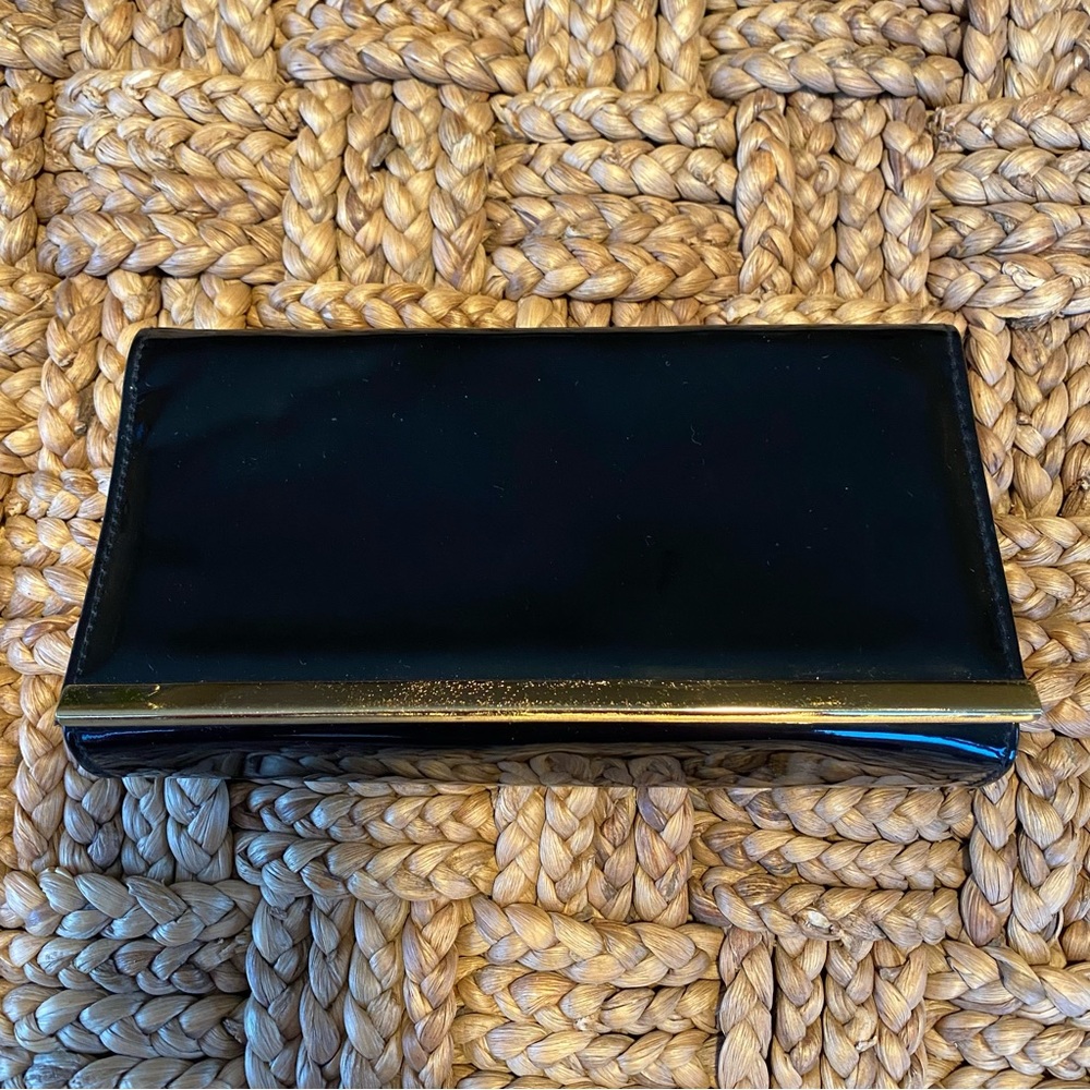 Black Clutch with Gold Metal Edge Magnetic Closure